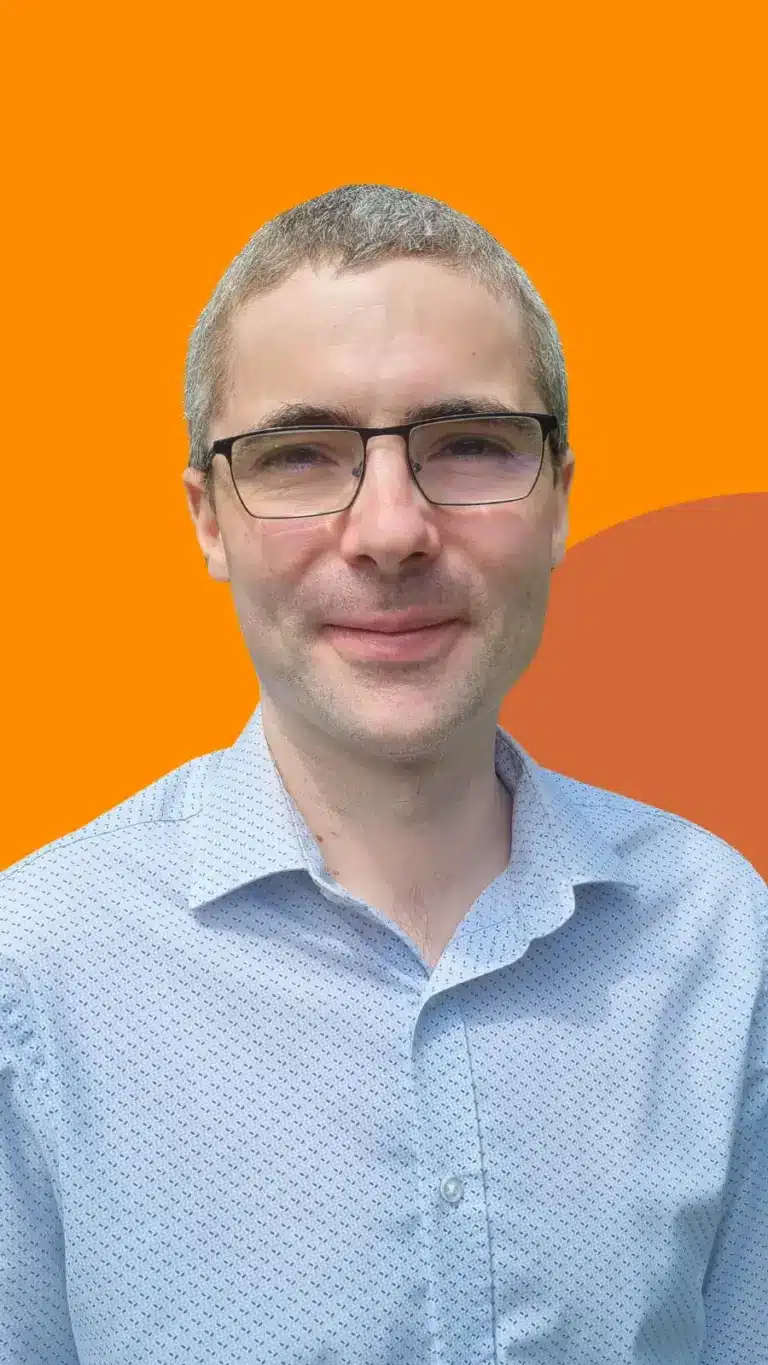 A picture of one of our trustees, Harvey, on an orange background
